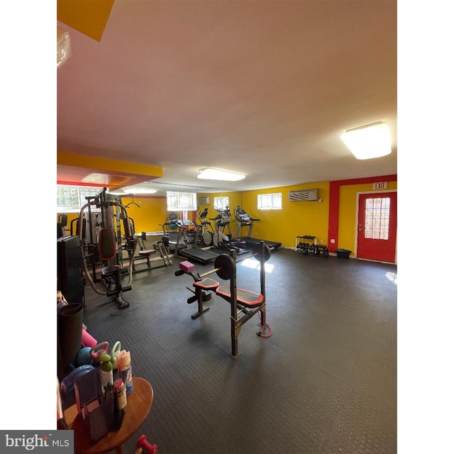 exercise room featuring a wall mounted air conditioner