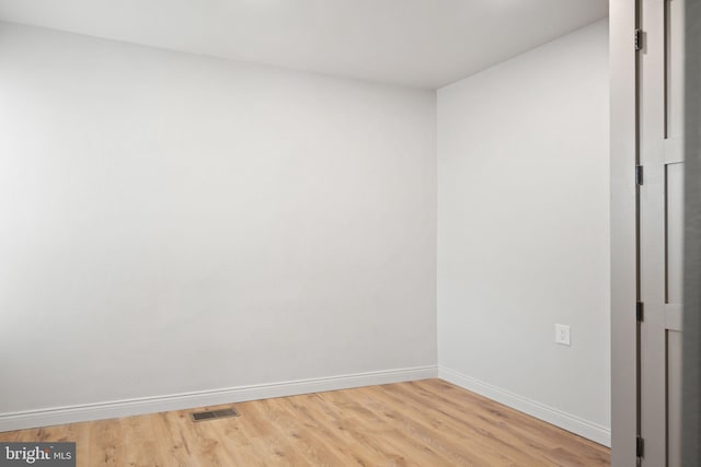 spare room with light wood-type flooring