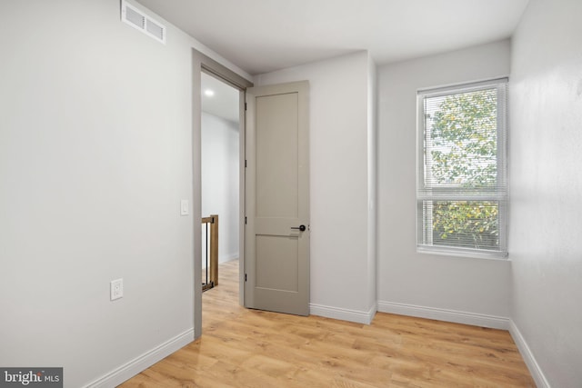 unfurnished bedroom featuring light wood-type flooring