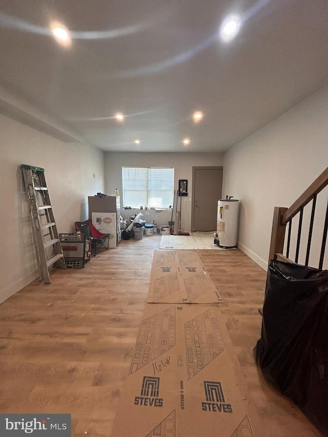 interior space featuring water heater and light hardwood / wood-style floors