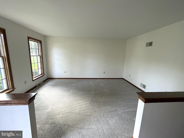 empty room with carpet flooring