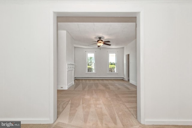 hallway featuring light colored carpet