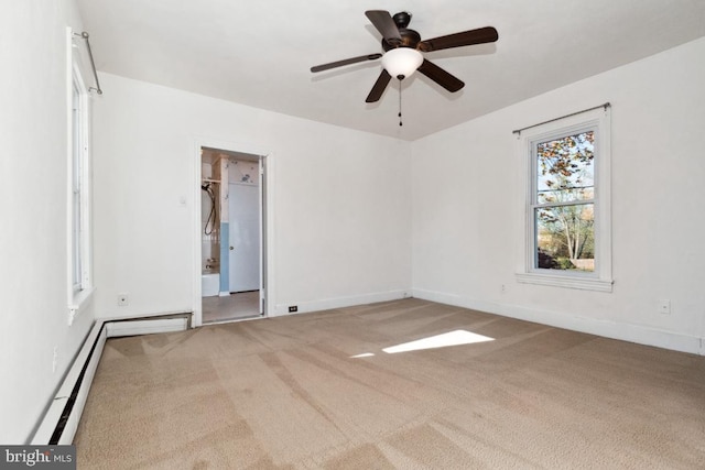 spare room featuring ceiling fan, carpet floors, and a baseboard radiator