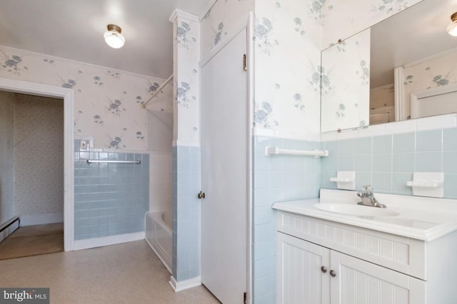 bathroom with  shower combination, vanity, and tile walls