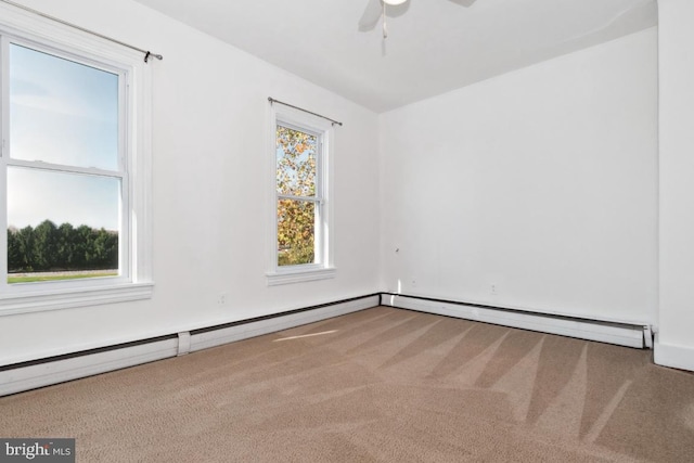 carpeted empty room with ceiling fan, baseboard heating, and a baseboard heating unit