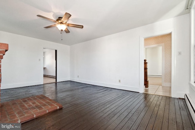 unfurnished room featuring a baseboard radiator, dark hardwood / wood-style flooring, and ceiling fan