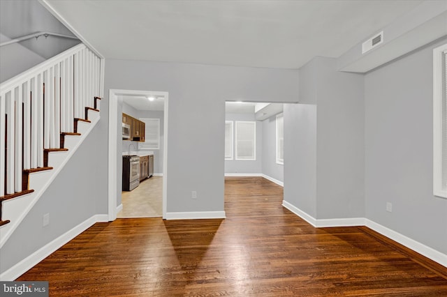 unfurnished living room featuring wood-type flooring