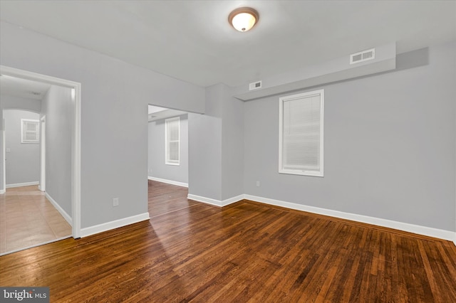 unfurnished room with hardwood / wood-style flooring