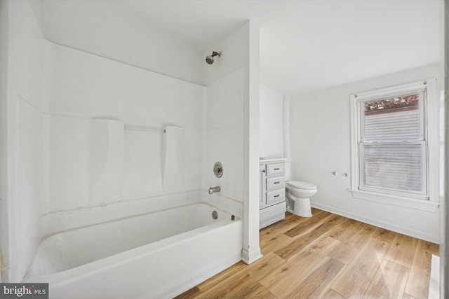 full bathroom featuring toilet, shower / bathing tub combination, vanity, and hardwood / wood-style floors