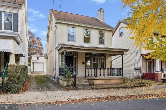 view of front of property featuring a garage and covered porch