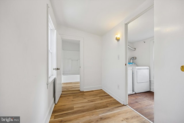 interior space featuring light hardwood / wood-style floors and washing machine and dryer