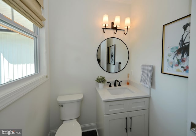 bathroom featuring toilet and vanity