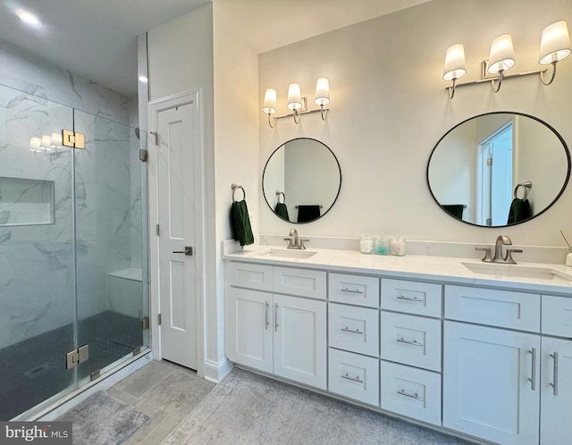 bathroom with walk in shower and vanity