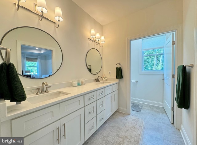 bathroom with vanity and tile patterned floors