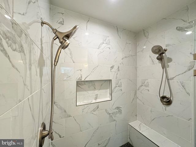 bathroom featuring tiled shower