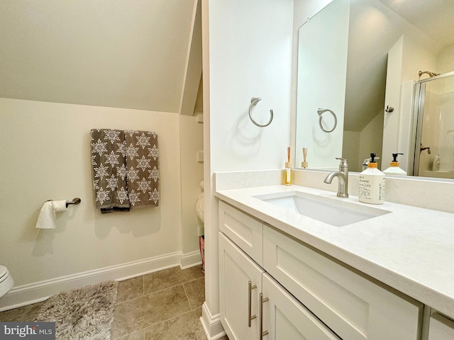 bathroom featuring walk in shower, vanity, toilet, and vaulted ceiling