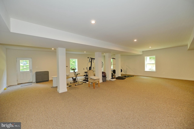 workout area featuring light colored carpet