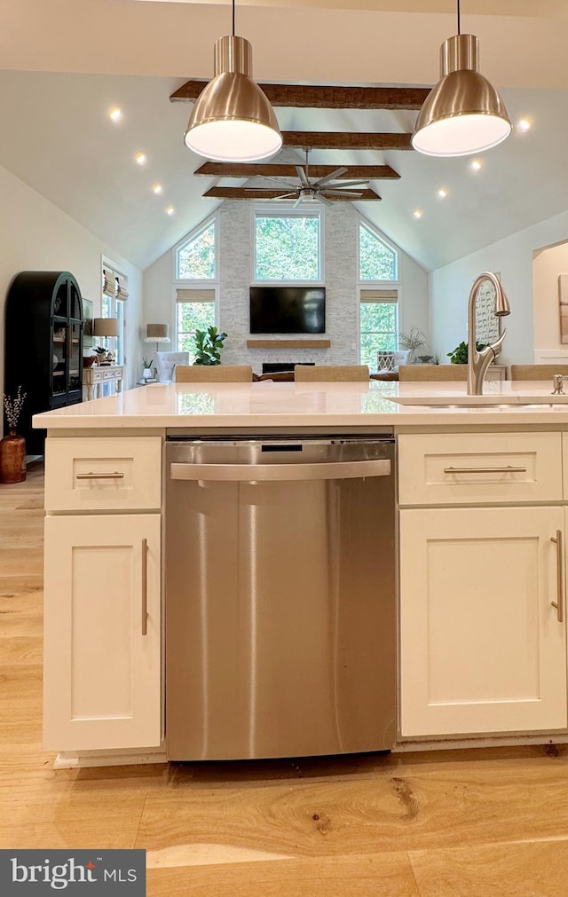 kitchen with pendant lighting, dishwasher, ceiling fan, white cabinetry, and light wood-type flooring