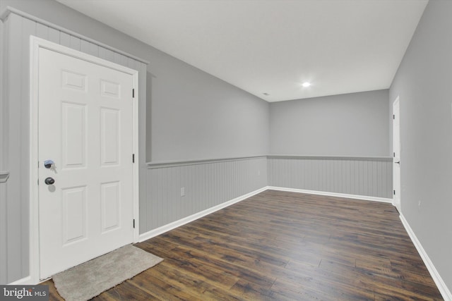 empty room featuring dark wood-type flooring