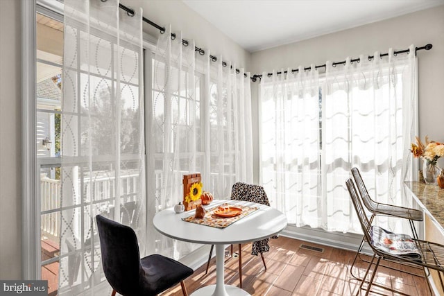 dining area featuring wood-type flooring