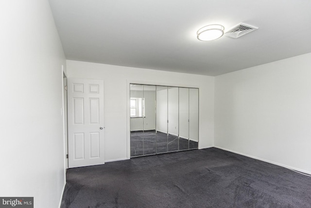 4624 Rhawn St, Philadelphia, PA 19136 - unfurnished bedroom with dark carpet, baseboards, and a closet