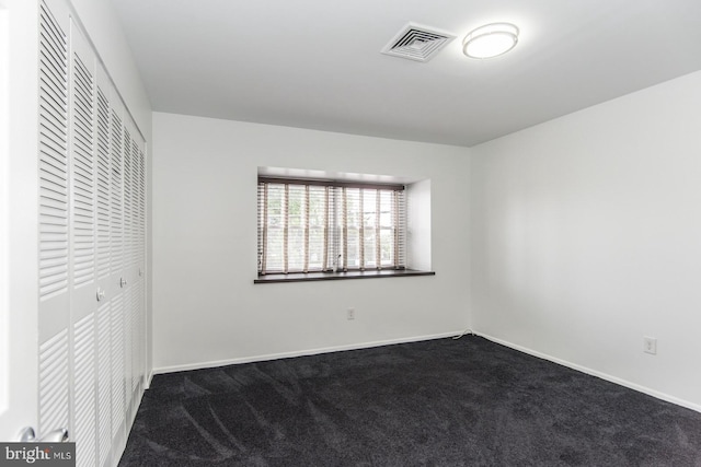 4624 Rhawn St, Philadelphia, PA 19136 - unfurnished bedroom with dark carpet, a closet, and baseboards