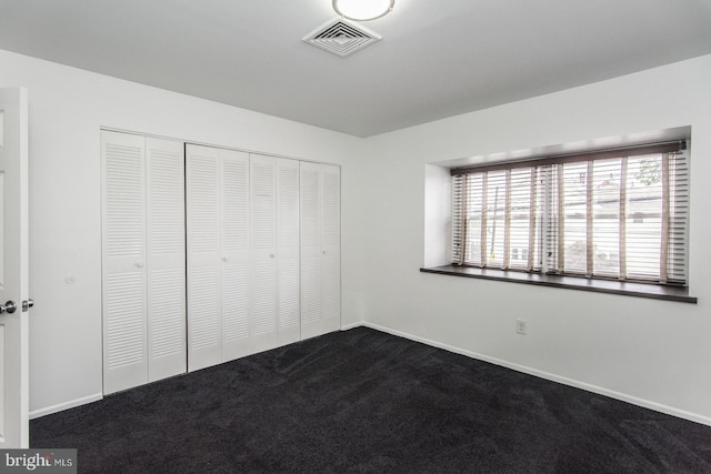 4624 Rhawn St, Philadelphia, PA 19136 - unfurnished bedroom featuring dark colored carpet, a closet, and baseboards