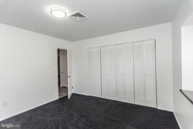 4624 Rhawn St, Philadelphia, PA 19136 - unfurnished bedroom with dark carpet, baseboards, and a closet