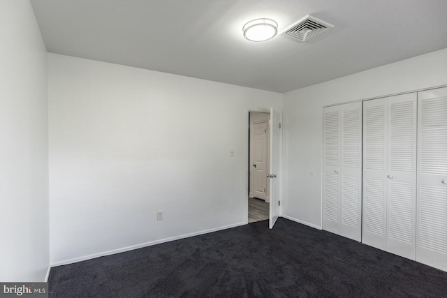 4624 Rhawn St, Philadelphia, PA 19136 - unfurnished bedroom featuring dark carpet, a closet, and baseboards