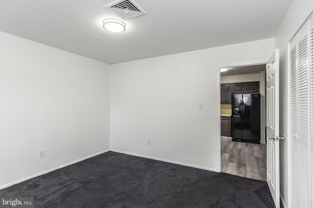 4624 Rhawn St, Philadelphia, PA 19136 - spare room with dark carpet and baseboards