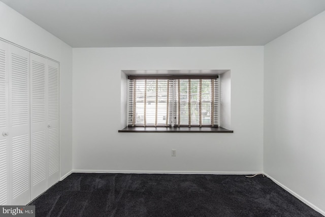 4624 Rhawn St, Philadelphia, PA 19136 - unfurnished bedroom with dark colored carpet, a closet, and baseboards