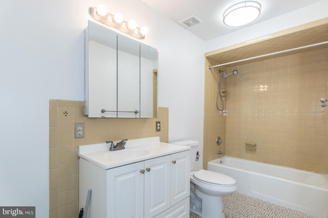 4624 Rhawn St, Philadelphia, PA 19136 - bathroom with toilet, vanity, shower / bathtub combination, tile patterned floors, and tasteful backsplash