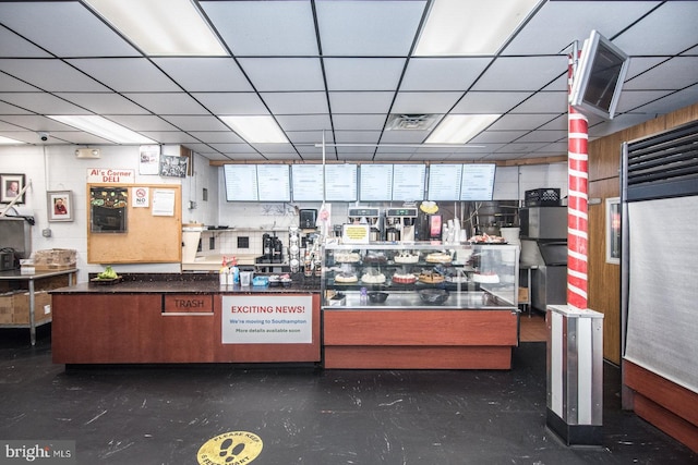 kitchen featuring a drop ceiling