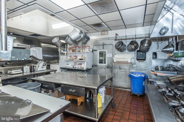 kitchen featuring dark tile patterned floors