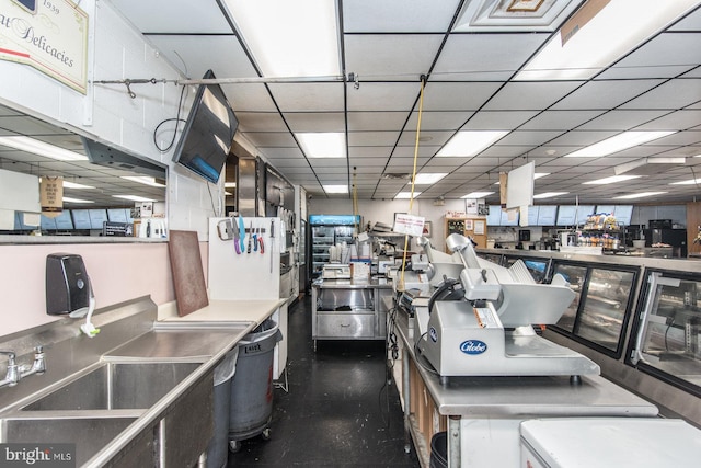 kitchen with a drop ceiling and sink