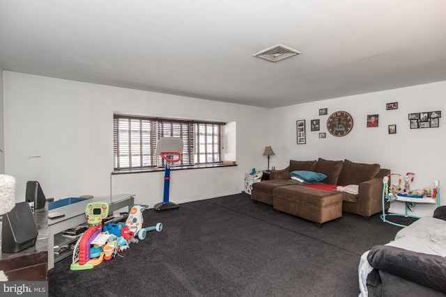 living room with dark colored carpet