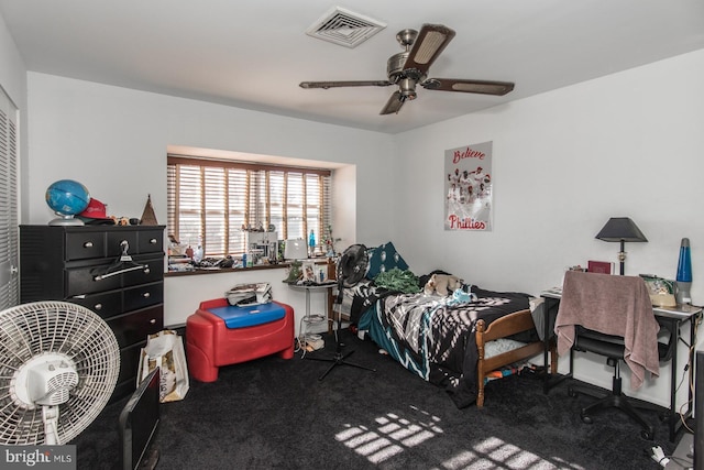 bedroom with carpet, visible vents, and a ceiling fan