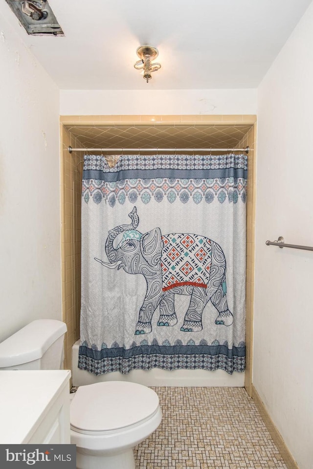 full bathroom featuring vanity, toilet, and shower / bathtub combination with curtain