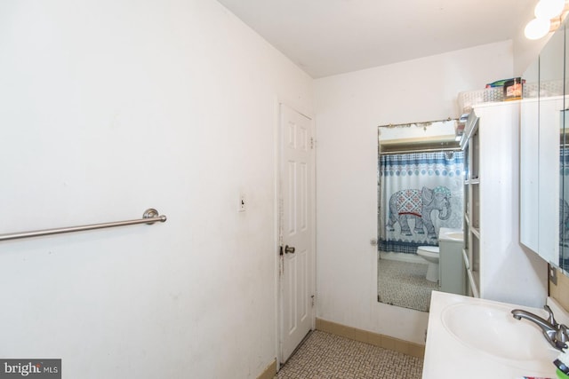bathroom featuring toilet, tile patterned flooring, vanity, and a shower with shower curtain