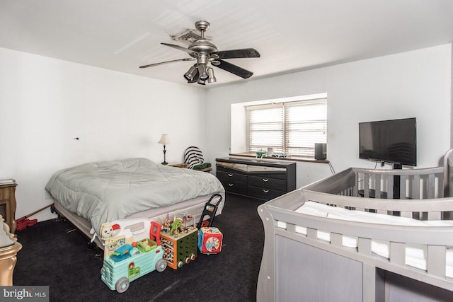 carpeted bedroom with ceiling fan