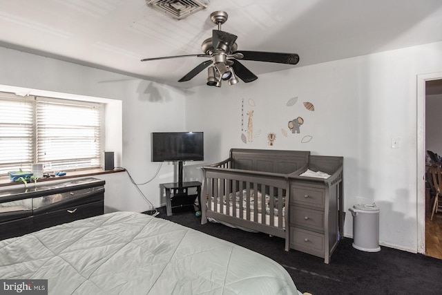 carpeted bedroom featuring ceiling fan