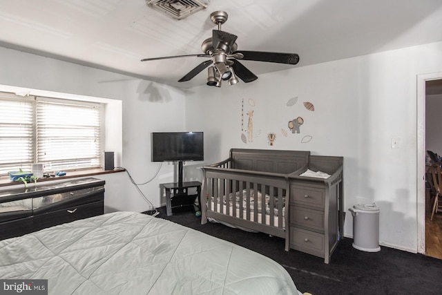 bedroom featuring visible vents, ceiling fan, and carpet floors