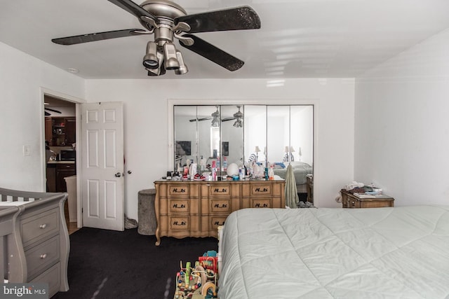 bedroom featuring ceiling fan and dark colored carpet