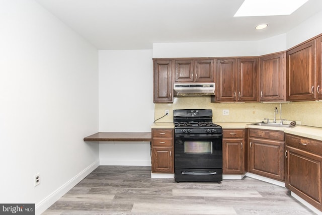 4624 Rhawn St, Philadelphia, PA 19136 - kitchen featuring black gas range oven, under cabinet range hood, a sink, light countertops, and recessed lighting