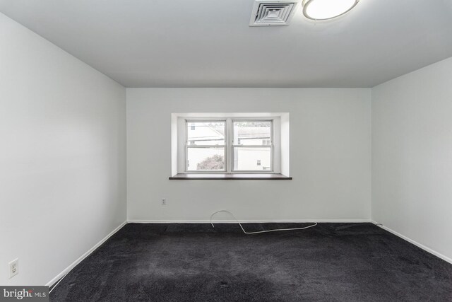 4624 Rhawn St, Philadelphia, PA 19136 - empty room featuring dark colored carpet and baseboards