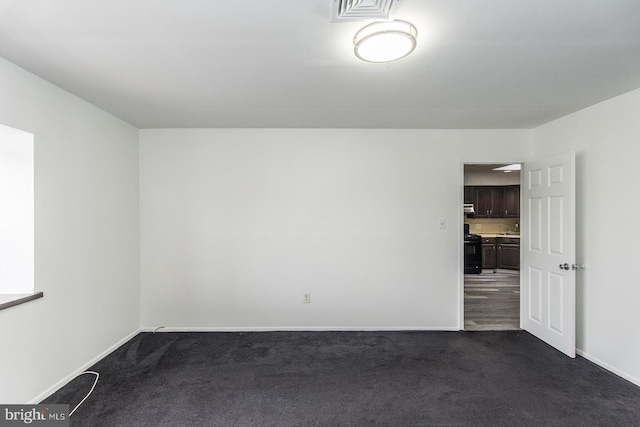 4624 Rhawn St, Philadelphia, PA 19136 - spare room featuring dark carpet and baseboards
