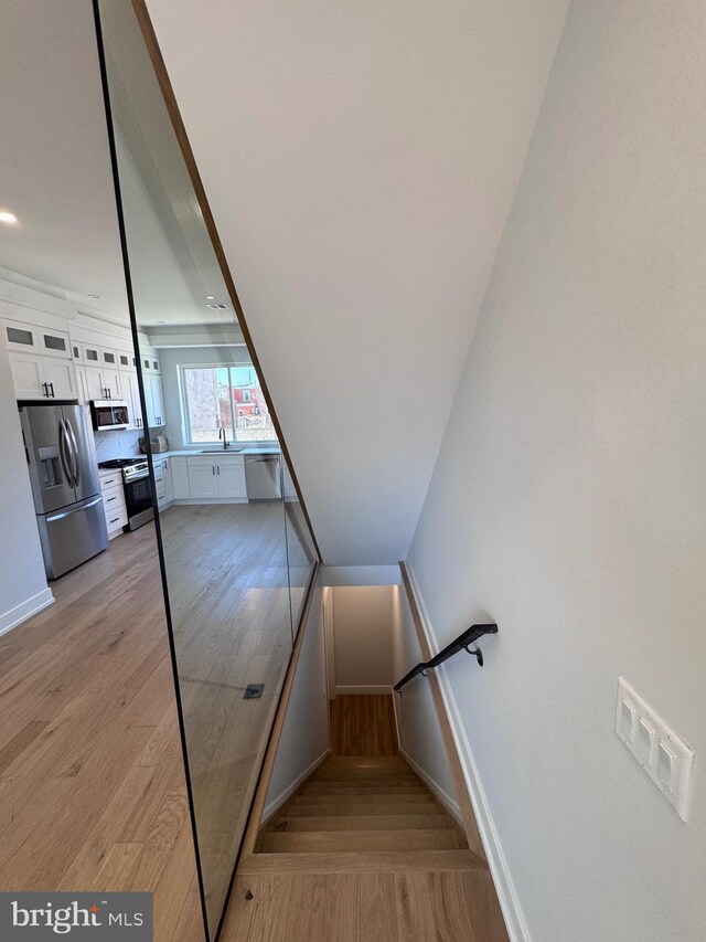 3003 Gaul St, Philadelphia, PA 19134 - staircase with baseboards, visible vents, and wood finished floors