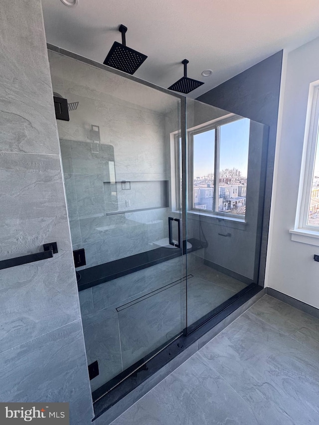 3003 Gaul St, Philadelphia, PA 19134 - bathroom featuring marble finish floor, baseboards, and a shower stall