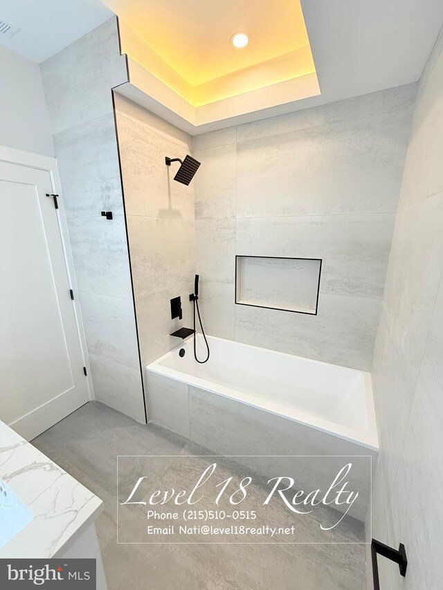 3003 Gaul St, Philadelphia, PA 19134 - full bathroom with a tray ceiling, tiled shower / bath combo, visible vents, and recessed lighting