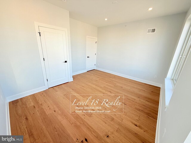 3003 Gaul St, Philadelphia, PA 19134 - unfurnished bedroom with light wood-style floors, visible vents, baseboards, and recessed lighting